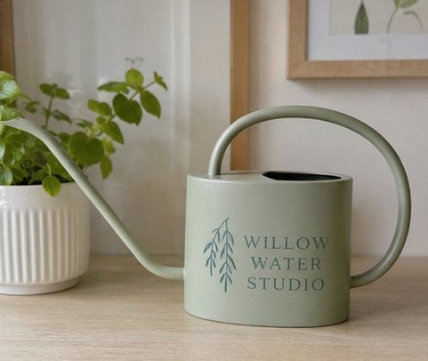 Modern long-spout precision watering can with a minimalist generic brand logo